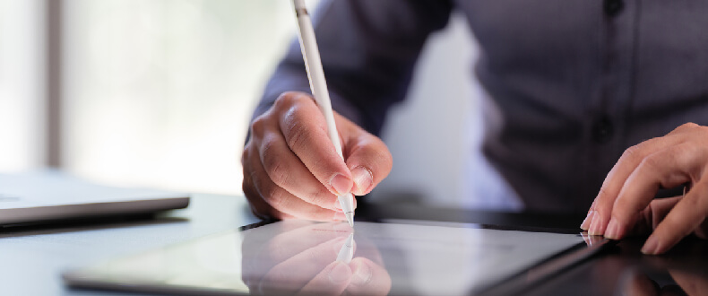 man writing on a tablet with a pen litigation